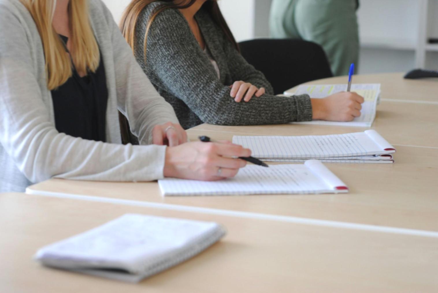 Professional financial consultation workspace with documents and calculator